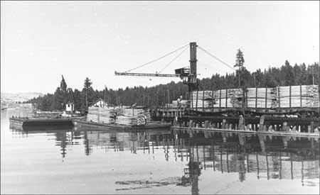 unloading lumber from barge