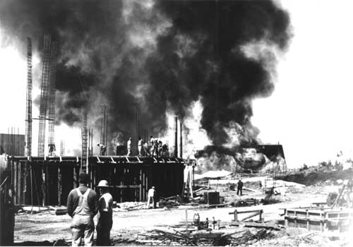 Paradise Visitor Center is under construction as Paradise Lodge burns, 1965