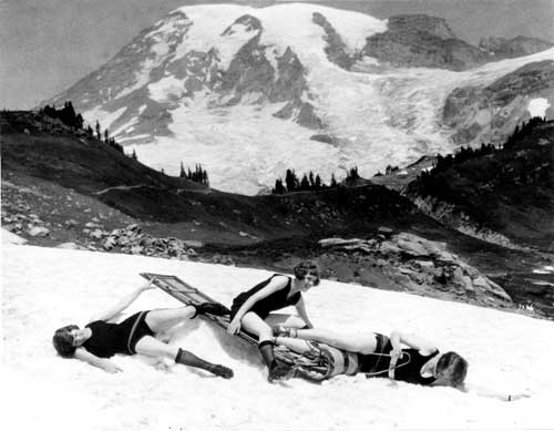 Young women engaged in summer snowplay