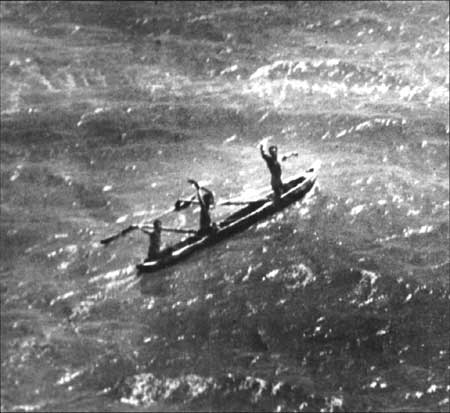 Native men in canoe