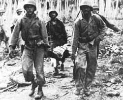 Marines carrying wounded soldier