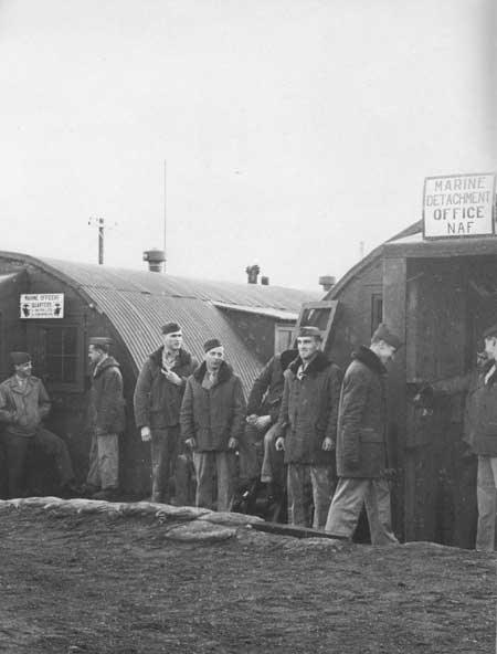 Marines in front of Nissen huts