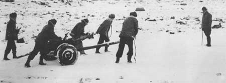 crew of a 37mm antitank gun maneuver