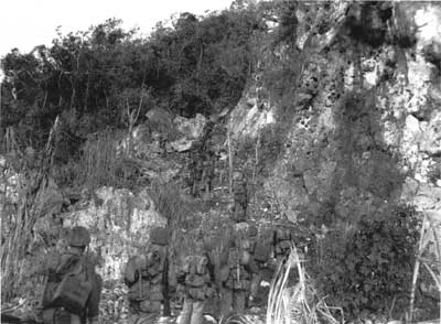 Marines ascending cliff