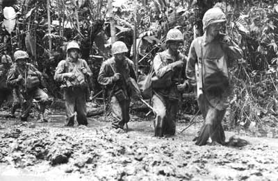 Marines slogging through mud