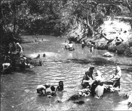 women and children in river