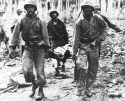 Marines carrying wounded soldier