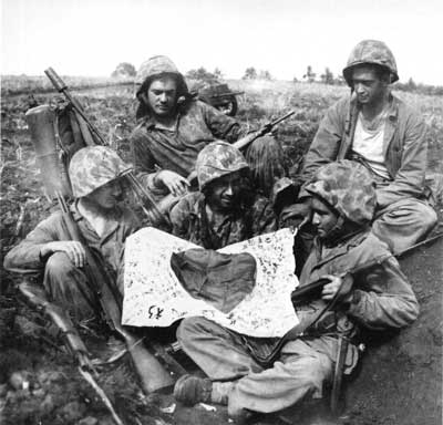 Marines holding Japanese flag