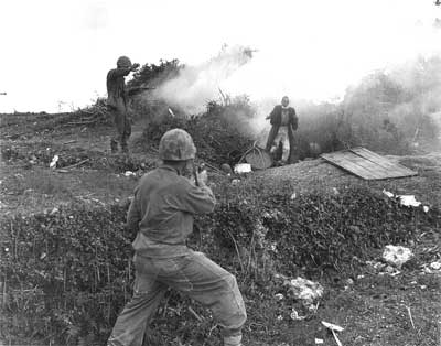 Okinawan civilian is flushed from a cave