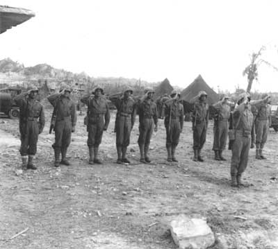 Marines saluting flag