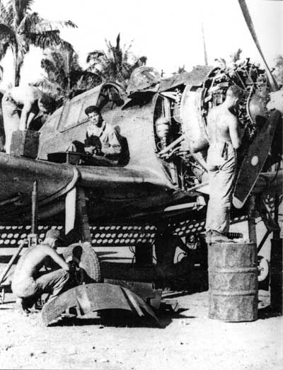 ground crew working on airplane