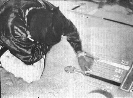 Navajo working on sand painting