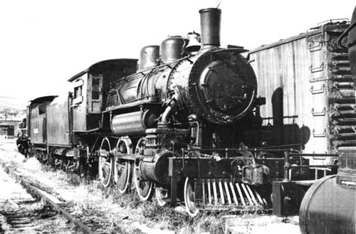 Young man looking out of train window on the historic steam engine