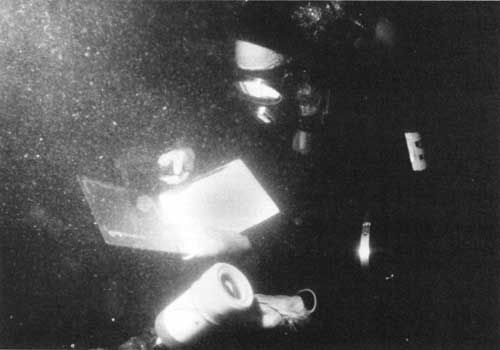 divers recording bathycorrometer readings