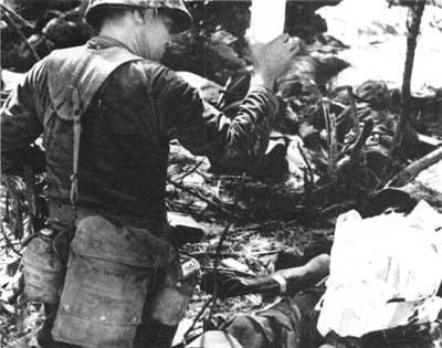 Navy corpsmen treating wounded