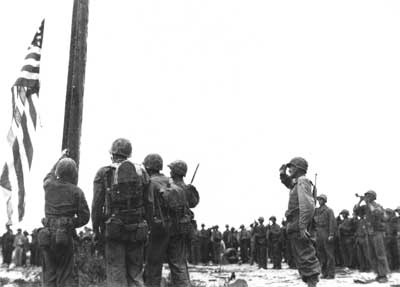 raising the American flag over Guam