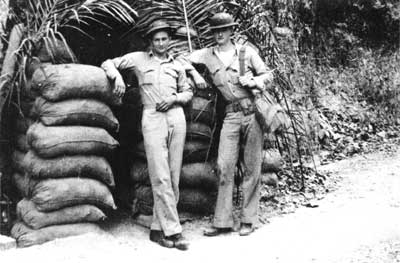 Marines relax outside a bunker