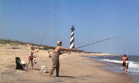 surf casting with lighthouse behind