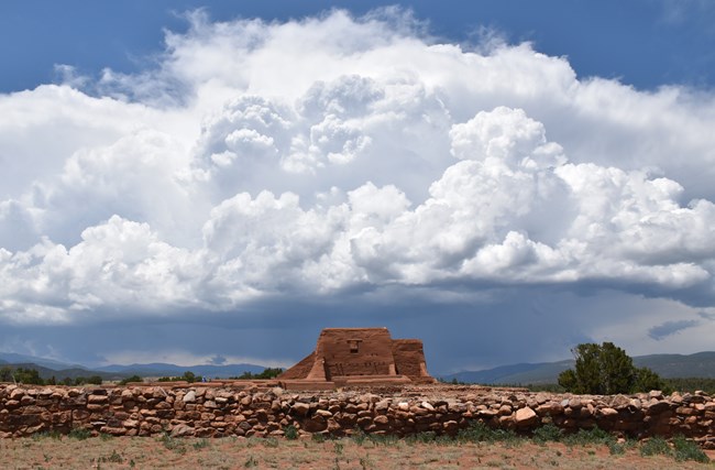 Storm clouds with contrasting white and dark blue about Pecos mission church