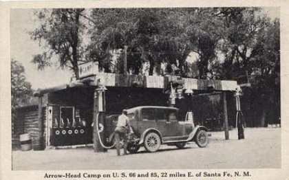 Vintage postcard of car being fueled at a gas station