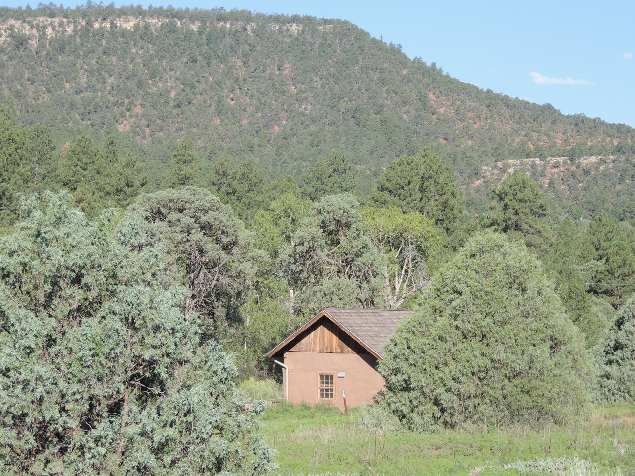 Picture of Pigeon's Ranch with Glorieta Mesa in the background.