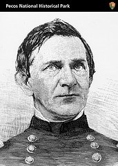 A black and white portrait of a man in a military uniform.