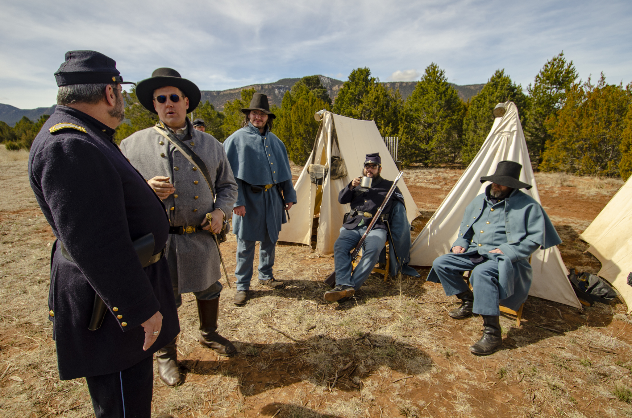 Civil War Encampment camp 2019 Men dressed in Civil War uniforms with canvas tents behind them.