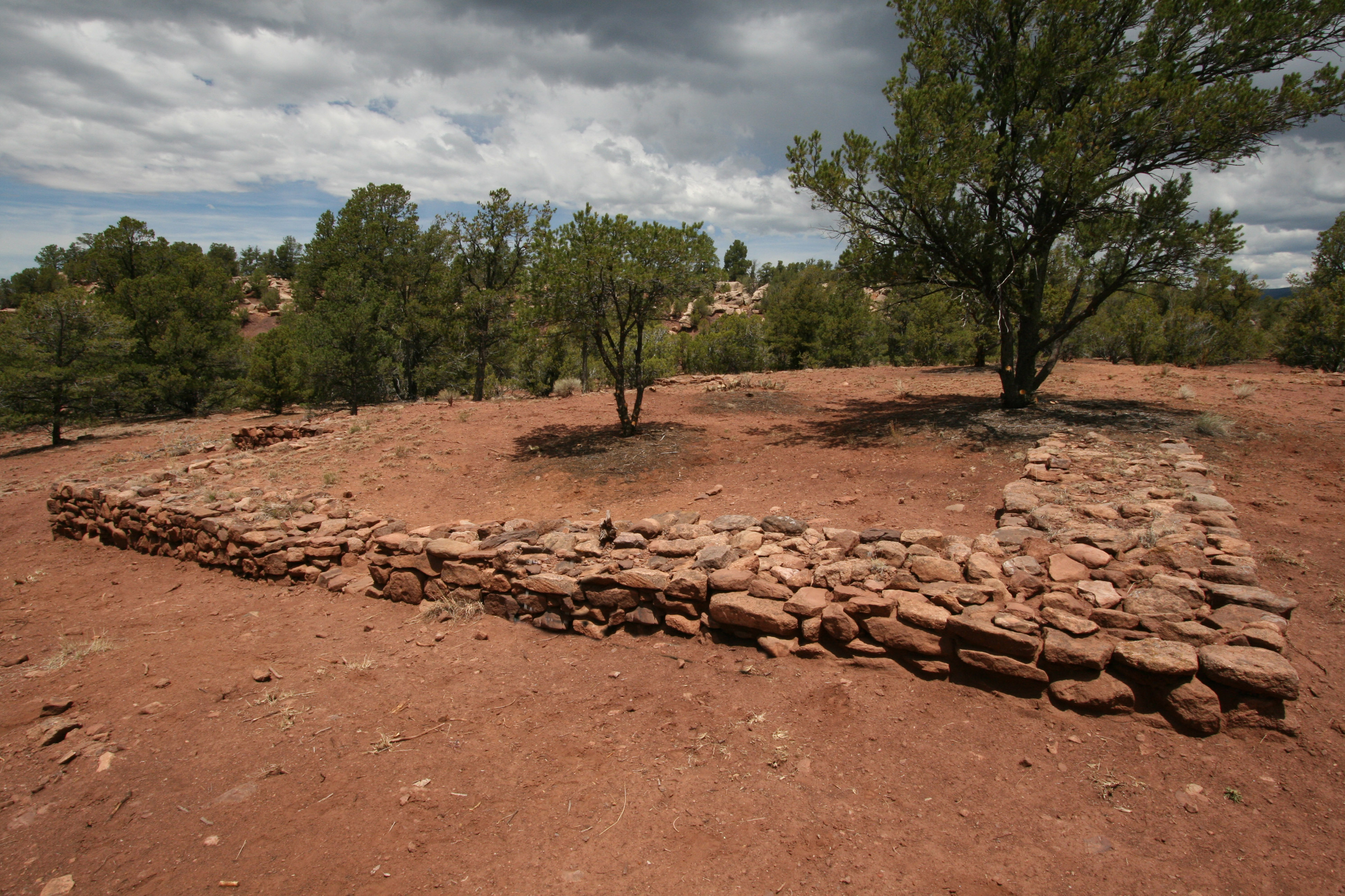 Sandstone Walls, Red Soil, Trees