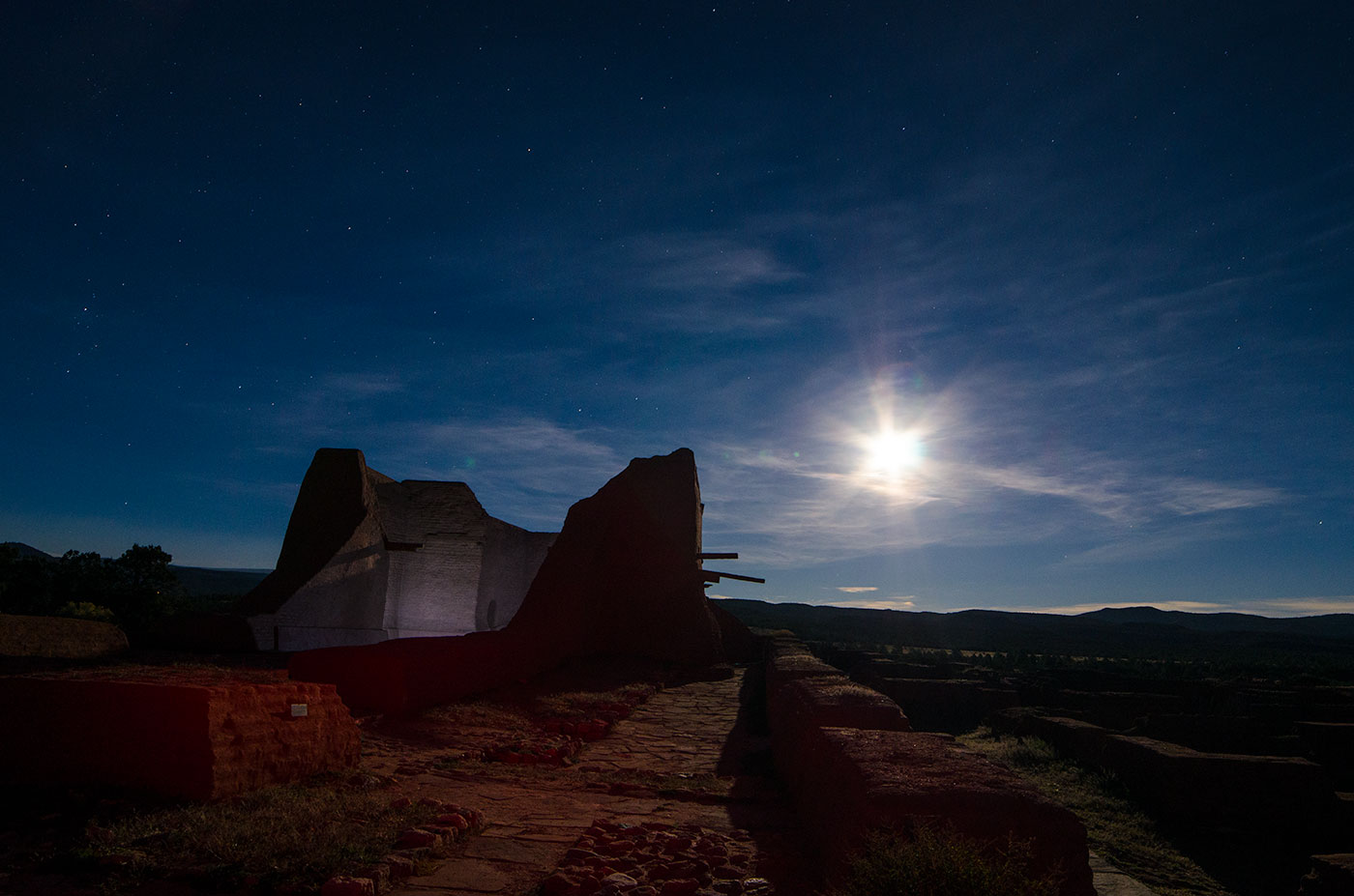 Moonrise over an old building