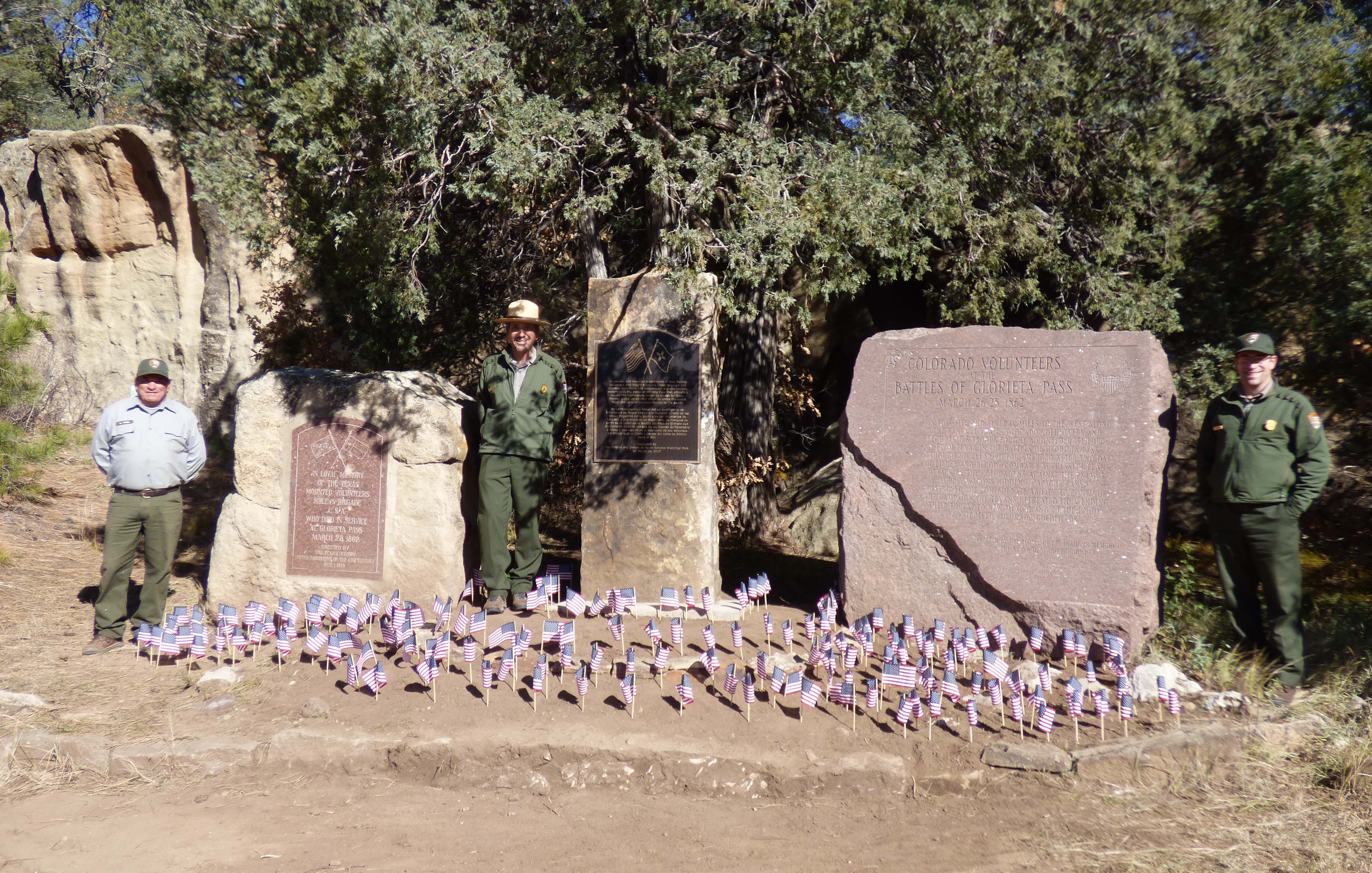 Veterans Day Flags 2018 American flags around stone monuments with rangers in between monuments.