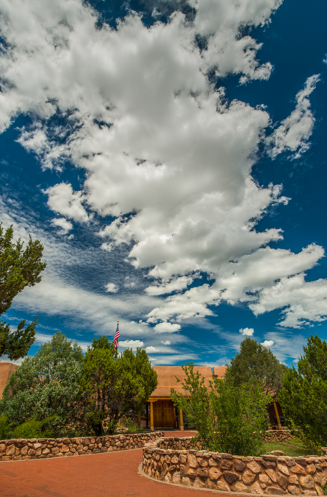 Pecos NHP Visitor Center The visitor center with blue sky and clouds overhead.