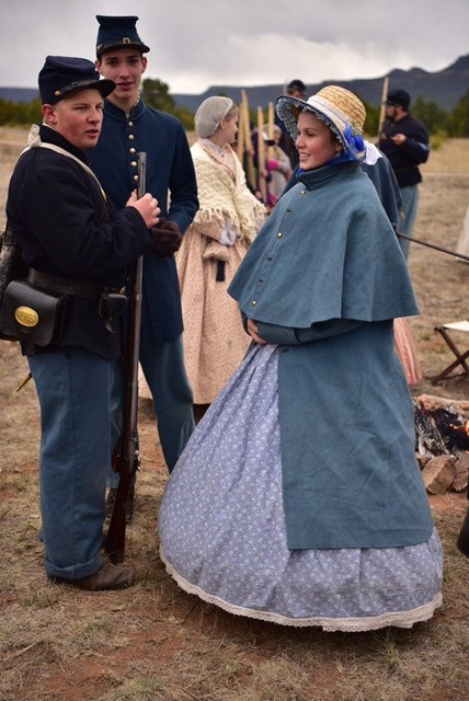 Two men and a woman in period garb.