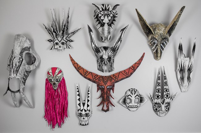 wall of masks by Jym Davis