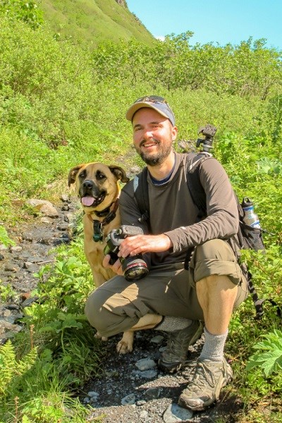 Portrait of Matt Tucker outdoors with dog
