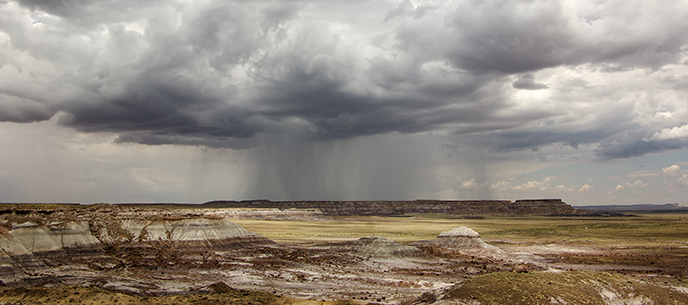storm over badlands landscape storm over badlands landscape