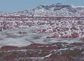 snow covers hills like icing sugar on a cake