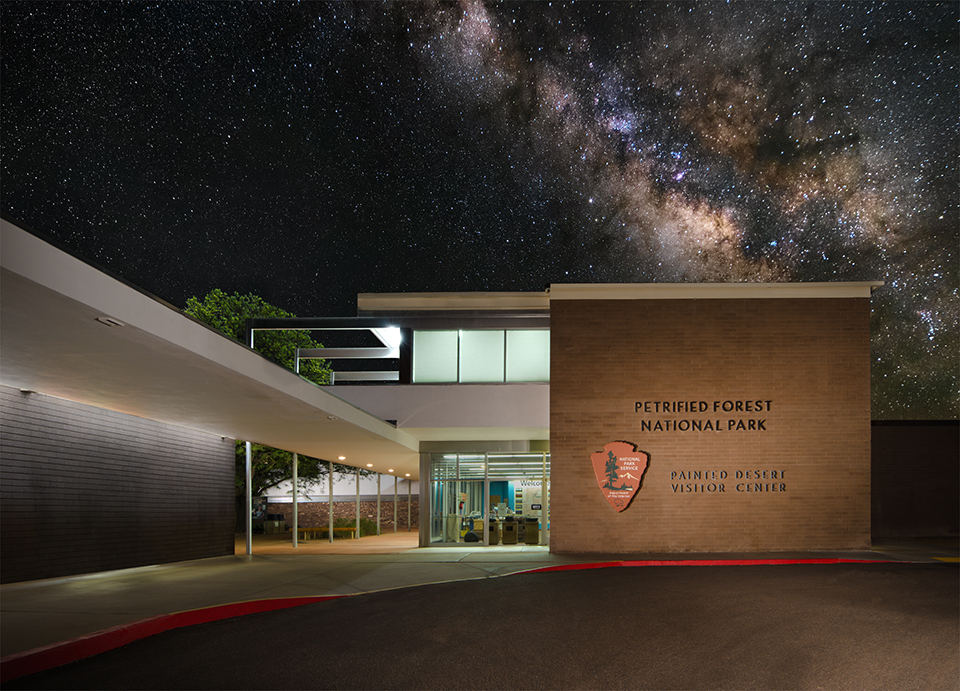 2018-06 PEFO VC photo w night sky above 960 Night at the Painted Desert Community Complex, stars above the softly lit historic buildings.
