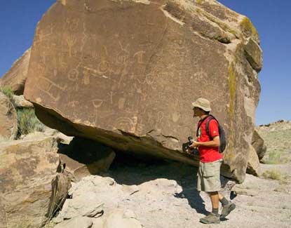 Brock in front of large sandstone block