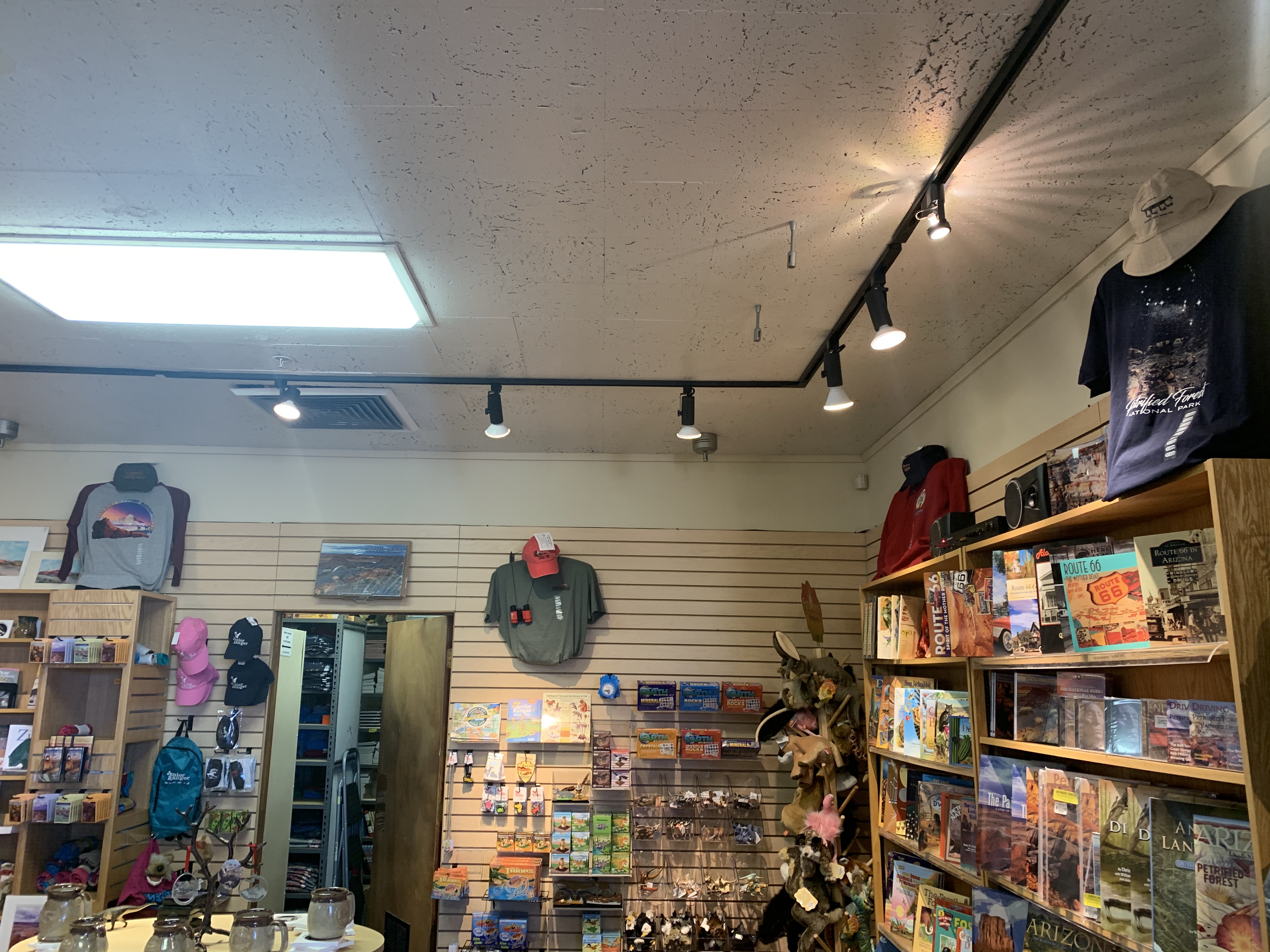 The bookstore at Rainbow Forest Museum with shelves of books, clothing, mugs, and other trinkets.