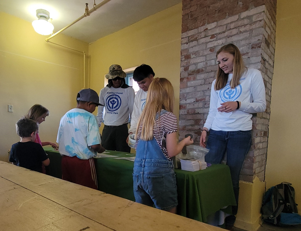 YCC crew members Skyler Joe, Kardell Morris, and Elenor Hansen give a presentation about fossils. YCC crew members Skyler Joe, Kardell Morris, and Elenor Hansen give a presentation about fossils.