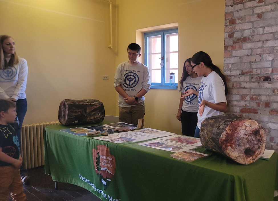 YCC crew members Ezekial Knight, Elena Philpott, and Alisa Johnson presentation about petrified wood YCC crew members Ezekial Knight, Elena Philpott, and Alisa Johnson presentation about petrified wood