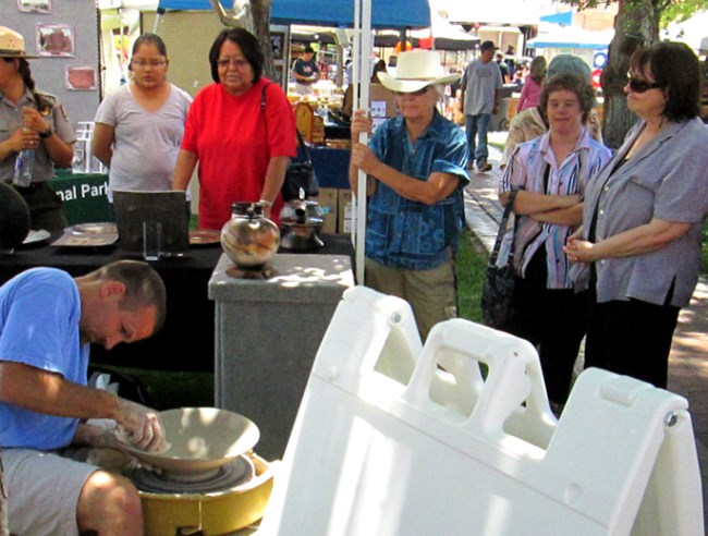 Brad Bachmeier demonstrating making a pot on a wheel