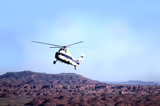 Helicopter hovering over the Painted Desert