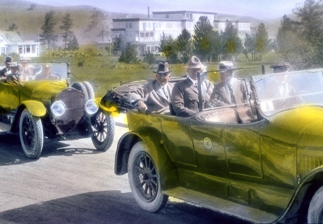 Yellowstone visitors riding in a Yellowstone Park Transportation Company bus circa 1919.