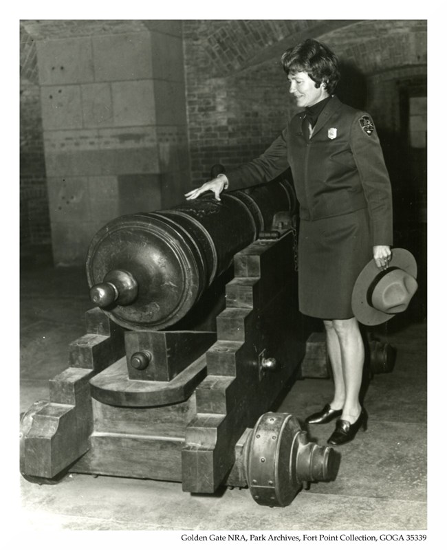 Supt Marjorie Hackett with a cannon at Fort Point