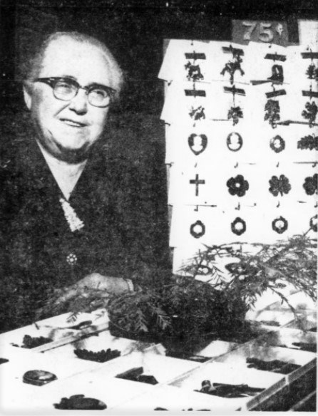 Viola Montgomery smiles at the camera with botanical merchandise and items.