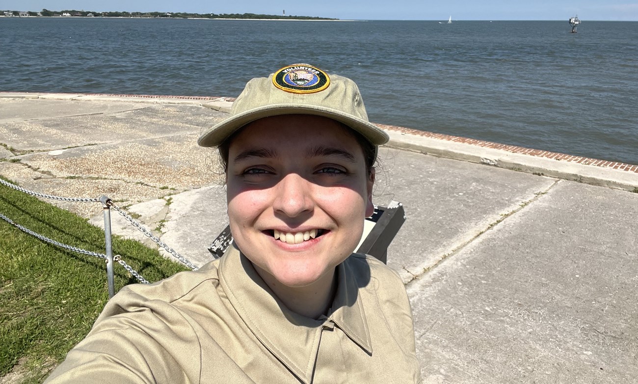 Amanda A young woman stands outside smiling