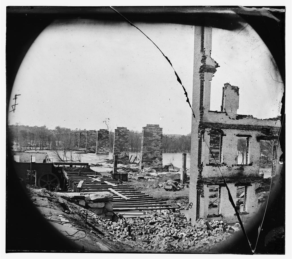 Glass negative photo of the Richmond Petersburg Railroad bridge destroyed in April 1865.
