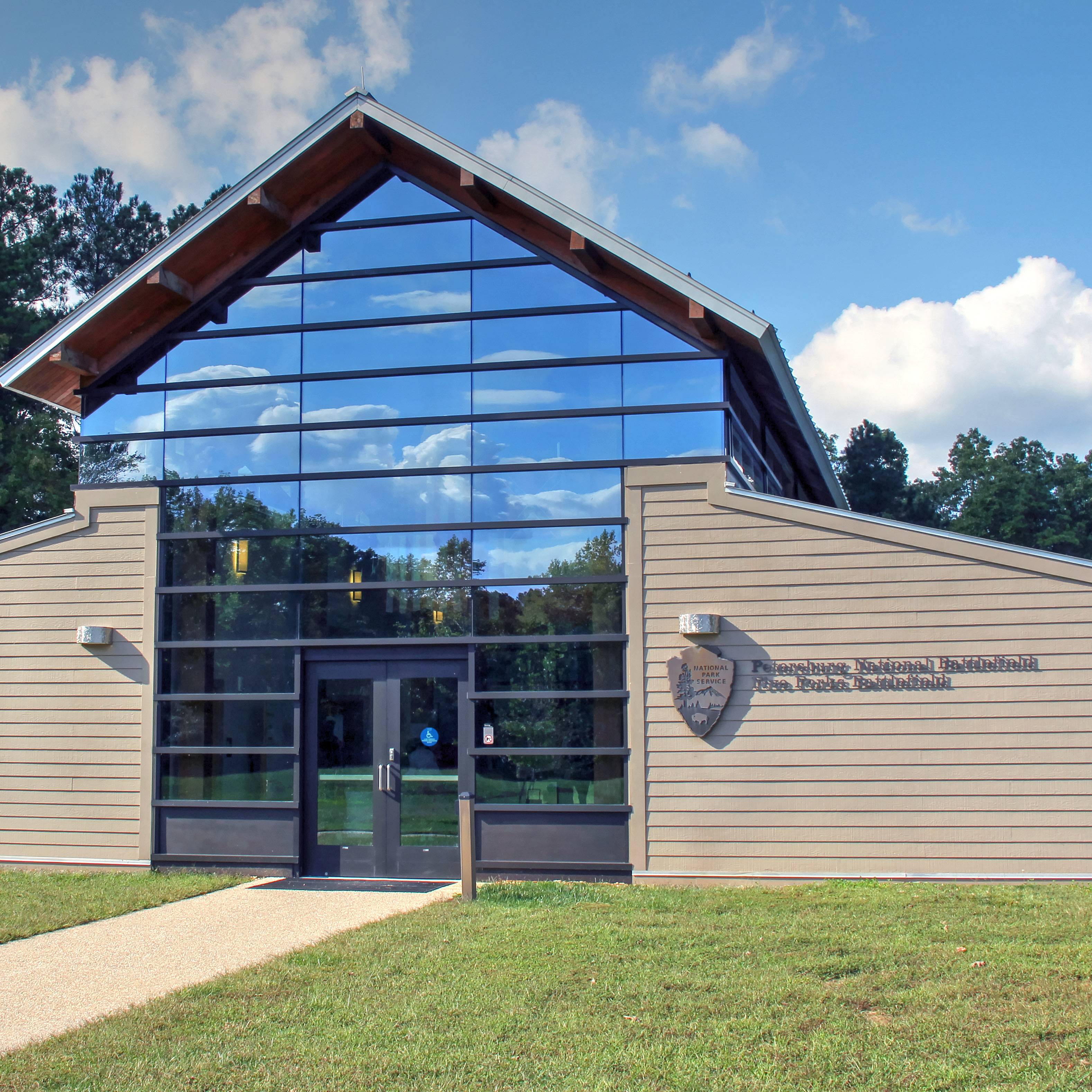 Five Forks Visitor Center A-Frame barn shaped building with large glass window wall in center.