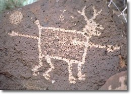 Petroglyph of a deer or pronghorn pierced by a spear.